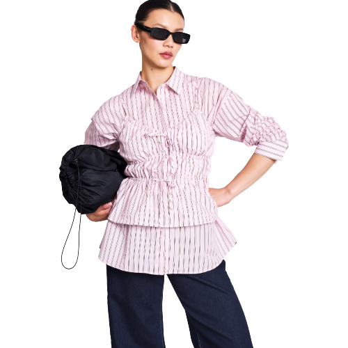 A light pink, long-sleeve, cropped blouse with a deep V-neck and two front tie closures, displayed on a white background.